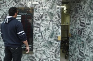 A man stands outside an exchange bureau in Cairo