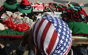 A Libyan vendor wearing a US flag bandan