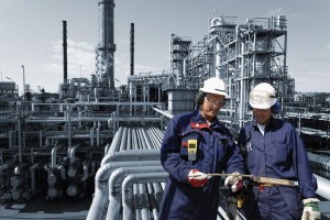 refinery workers inside oil and gas installation