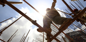 A construction worker walks on a scaffolding on a tunnel along the Nairobi-Thika highway project, under construction near Kenya's capital Nairobi, September 23, 2011. The road, which is being built by China Wuyi, Sinohydro and Shengeli Engineering Construction group, is funded by the Kenyan and Chinese government and the African Development Bank (AFDB). The project will cost 28 billion Kenyan shillings ($330million), according to the Chinese company. AfDB has cut the expected economic growth rate for Kenya in 2011 to 3.5-4.5 percent from an earlier forecast of 4.5-5 percent due to high inflation and a volatile exchange rate, the bank's country economist for Kenya said on Friday. REUTERS/Thomas Mukoya (KENYA - Tags: BUSINESS CONSTRUCTION)